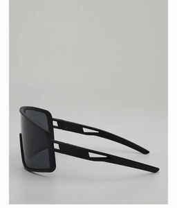 Detail view of matte black cycling glasses featuring aerodynamic hollowed-out temple design