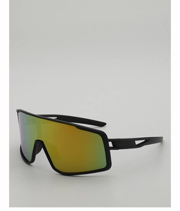 Detail view of matte black cycling glasses with vibrant green-yellow gradient lenses