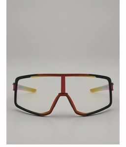 Detail of red and black cycling glasses with adjustable nose pads and clear wide lens