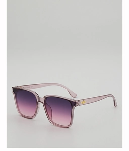 Detail of transparent lavender frame with golden cross hinge on gradient sunglasses