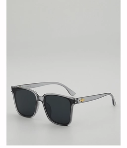 Detail view of square sunglasses with gray frame and gold star metal decoration