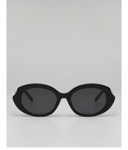 Detail of classic black oval sunglasses with thick textured frames and UV lenses