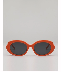 Macro detail of high-quality orange wide-frame sunglasses with dark gray lenses