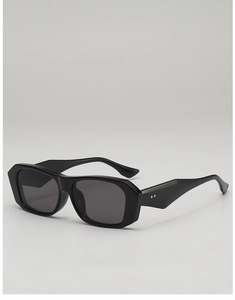Macro view of vintage black thick square frame sunglasses with silver rivets and grey lens