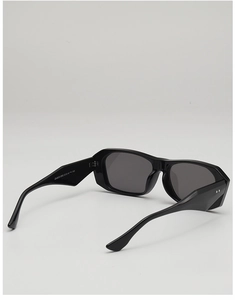 Close-up of black square sunglasses with geometric temple details and model ZN3872