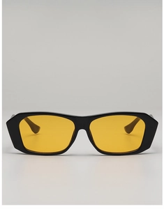 Detail of square vintage sunglasses with black geometric frame and bright yellow lenses