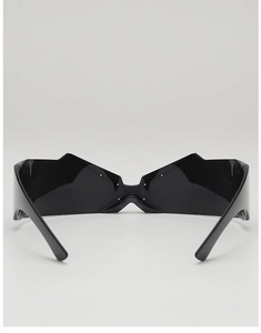 Macro side view of futuristic black one-piece wrap sunglasses with unique butterfly shape