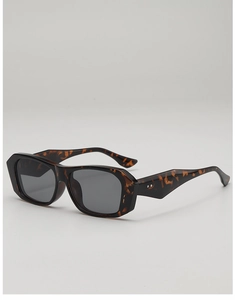 Detail of tortoise shell square sunglasses with silver double rivets on the temple