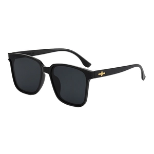 Classic large square black sunglasses with gold star metal detail and UV400 lenses