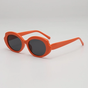 Retro orange wavy frame sunglasses for women with dark UV protection lenses
