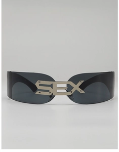 Detail of futuristic cyberpunk visor sunglasses featuring silver metal SEX letter ornament