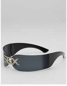 Detail of cyberpunk rimless sunglasses with wrap-around lenses and metal SEX lettering