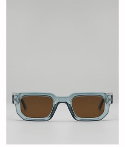 Vue détaillée de la monture rectangulaire bleu-gris avec verres bruns et charnières en métal