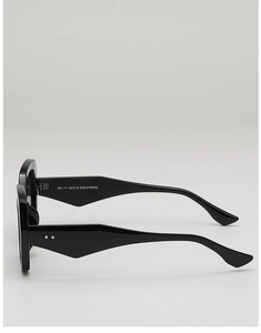 Detail shot of black thick frame sunglasses with metal rivets and model number ZN3813