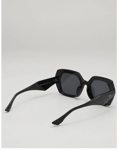 Detailed macro view of black square sunglasses with specifications on the inner temple arm
