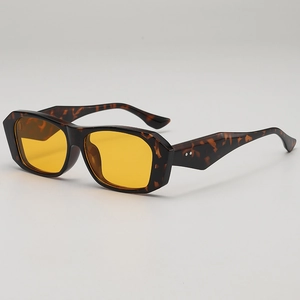 Vintage tortoiseshell rectangle sunglasses with yellow lenses and metal rivets detail