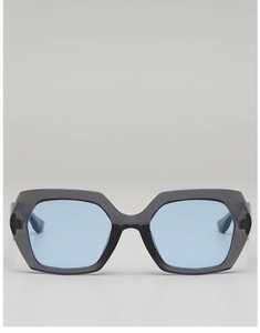 Close-up of geometric dark grey frames and light blue lenses with metal hinge details