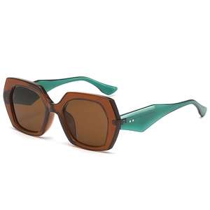 Polygonal oversized sunglasses with amber frame and contrasting blue-green temples