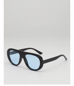 Detail of pilot-style sunglasses with thick black frames and blue translucent lenses