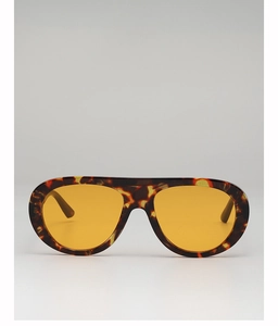 Detail of tortoise shell frame sunglasses with stylish yellow tinted ocean lenses