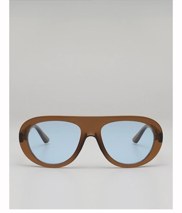 Detail view of the tea brown frame and blue semi-transparent lenses on aviator sunglasses