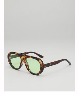 Detail of tortoise frame aviator sunglasses with vintage green lenses and metal hinges
