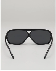 Detail view of double-bridge aviator sunglasses with black frames and geometric cutouts