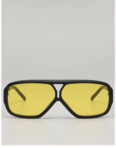Detail of pilot sunglasses with matte black frames and yellow lenses with triangle bridge