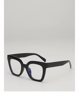 Detail of square black thick frames with blue light blocking lenses and a retro style