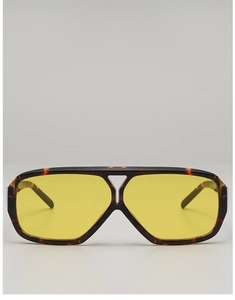 Close-up of retro double-bridge pilot sunglasses with tortoiseshell frame and yellow lenses
