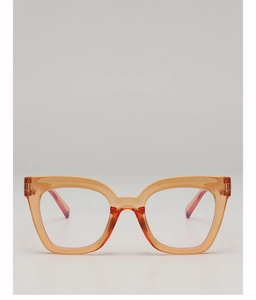 Close-up of warm orange translucent square eyeglass frame with tortoiseshell temples