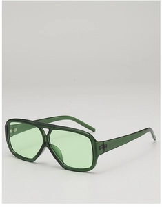 Detail of vintage double bridge sunglasses with green translucent frames and lenses