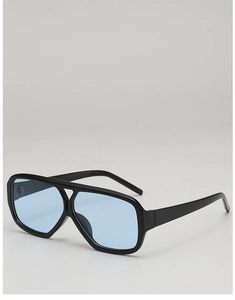 Close-up of retro black thick frames and transparent light blue lenses sunglasses