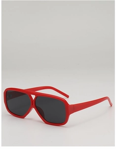 Detailed macro view of vibrant red double-bridge sunglasses with glossy finish