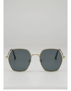 Macro detail of geometric gold metal frame and dark grey lenses on stylish sunglasses