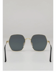 Detailed front view of high-end polygon sunglasses with gold frames and dark grey lenses