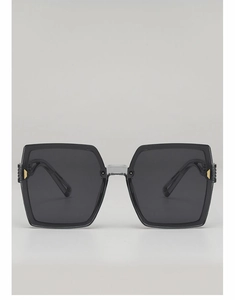 Vue de face de lunettes de soleil carrées oversize avec verres foncés et détails dorés