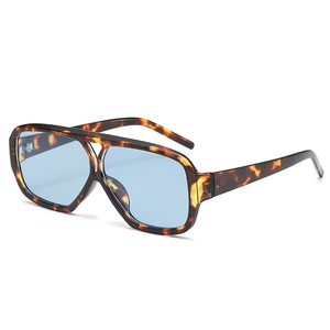 Retro double bridge tortoiseshell sunglasses with blue lenses in a 45-degree angle view