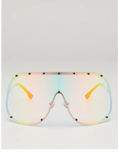 Macro view of oversized gradient sunglasses with black rivets and yellow temples