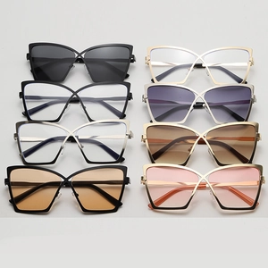 Flat lay of eight colorful cat eye metal frames with various gradient and clear lenses