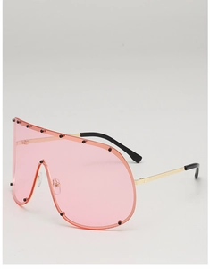 Detail of pink visor sunglasses with gold metal frame and black decorative rivets
