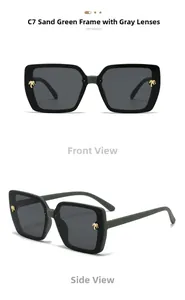 Detail of matte green square sunglasses featuring golden palm tree metal accents