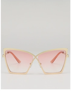Detail of pink gradient cat-eye sunglasses with gold metal cross bridge and frame