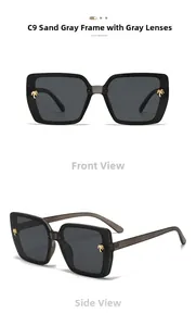Detail of square matte sand grey sunglasses with golden palm tree metal accents and grey lenses