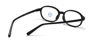 Detail view of oval kids' blue light glasses with 1089 48-14-131 specs on black temples