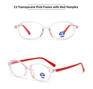 Detail view of pink oval eyeglass frames with red temples and blue light blocking lenses