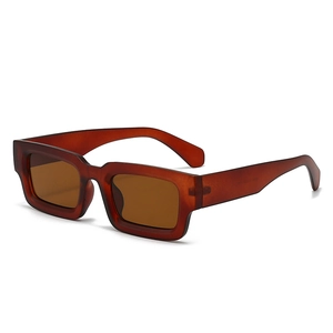 Lunettes de soleil rectangulaires rétro ambre translucide avec monture épaisse et verres