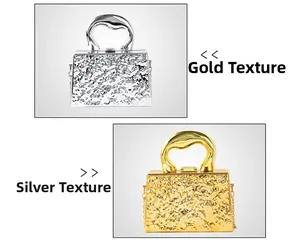 Detail of modern gold and silver ripple textured evening bags with metal handles