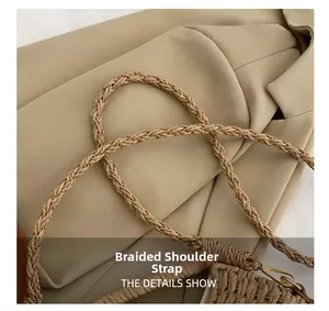 Close-up of woven shoulder strap with gold metal buckle on a woven crossbody bag