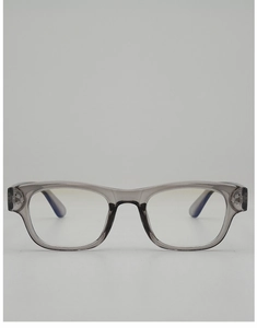 Detail of translucent grey square glasses frame with metallic star rivet decoration